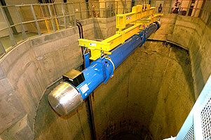 The first superconducting dipole magnet is lowered into the LHC tunnel