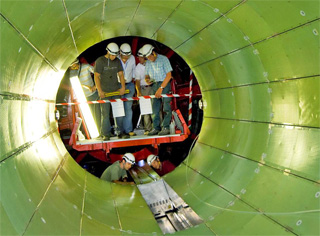The electromagnetic calorimeter barrel receives its thirty-sixth and final supermodule.